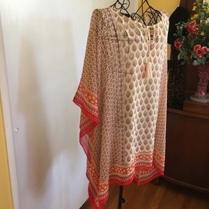 Orange and beige print sheet blouse.